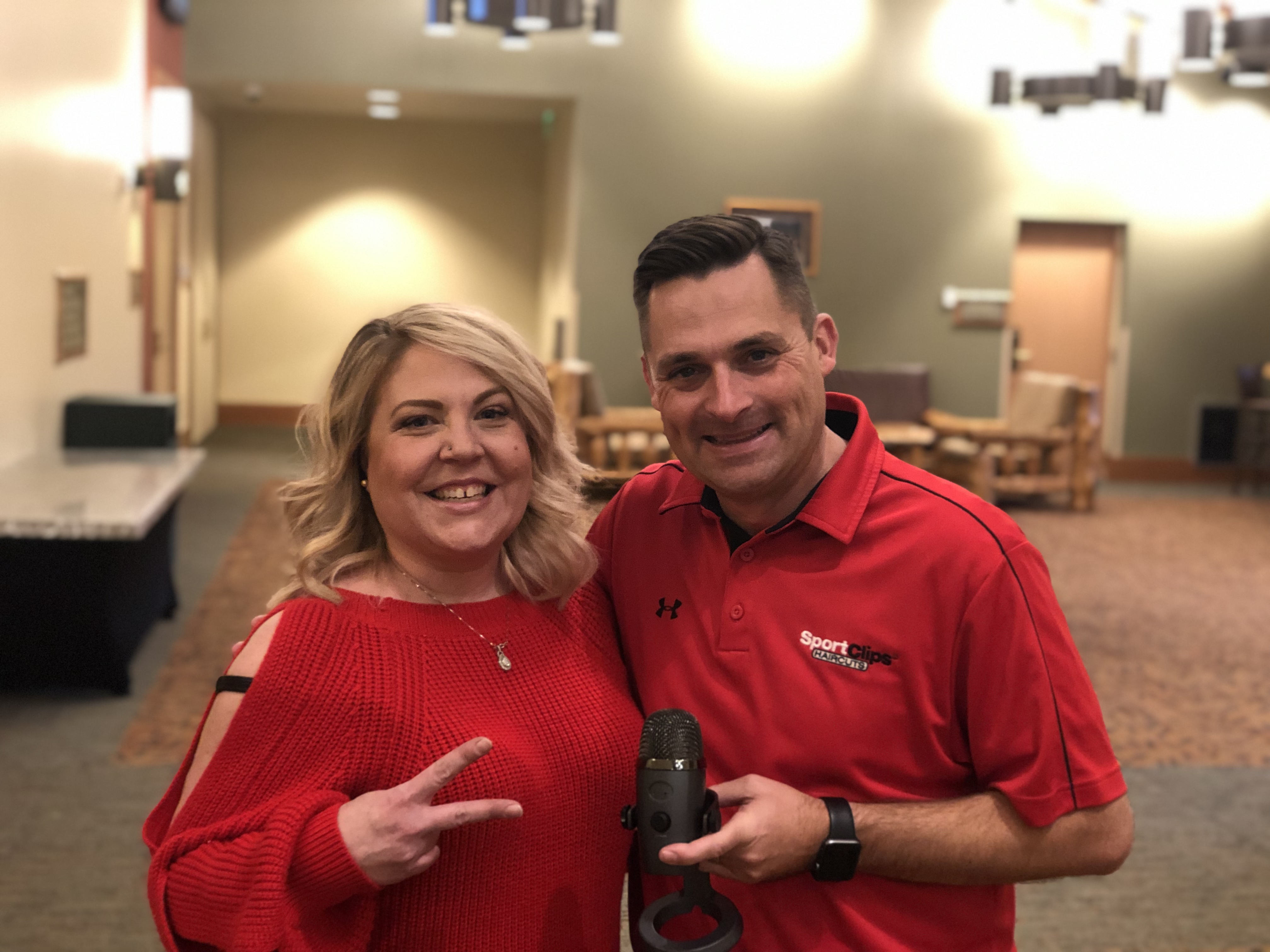 Chad and Brittany Clay holding a microphone at a Great Wolf Lodge
